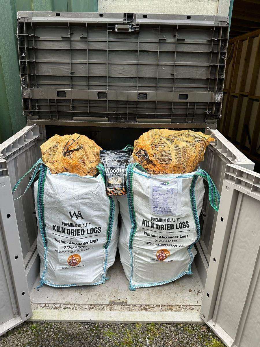 A delivery crate of firewood at the yard